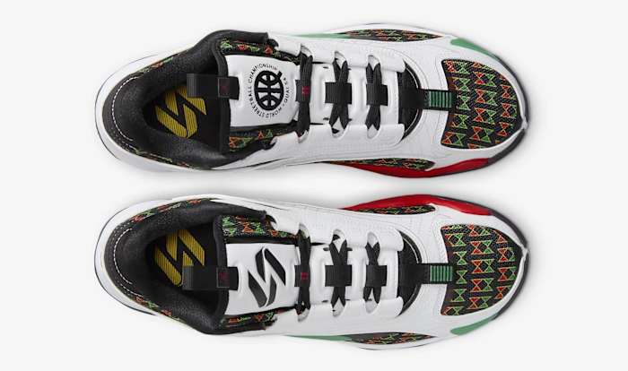 View of Luka Doncic's white, black, and green Jordan Brand sneakers.